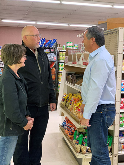 Commissioner Goehring visits with representatives from Tracy's Market in Fessenden, ND